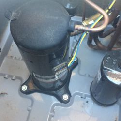 Compressor with hermetic seal inside of outdoor AC unit