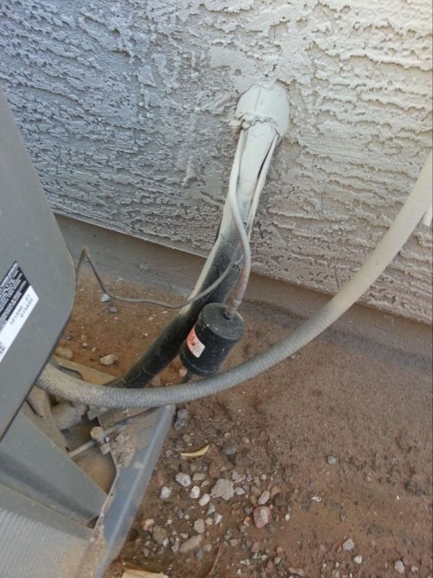 Refrigerant lines connected to outdoor AC unit